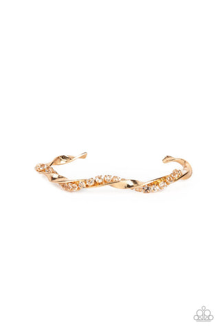 Twisted Twinkle - Gold - White Rhinestone Warped Paparazzi Cuff Bracelet